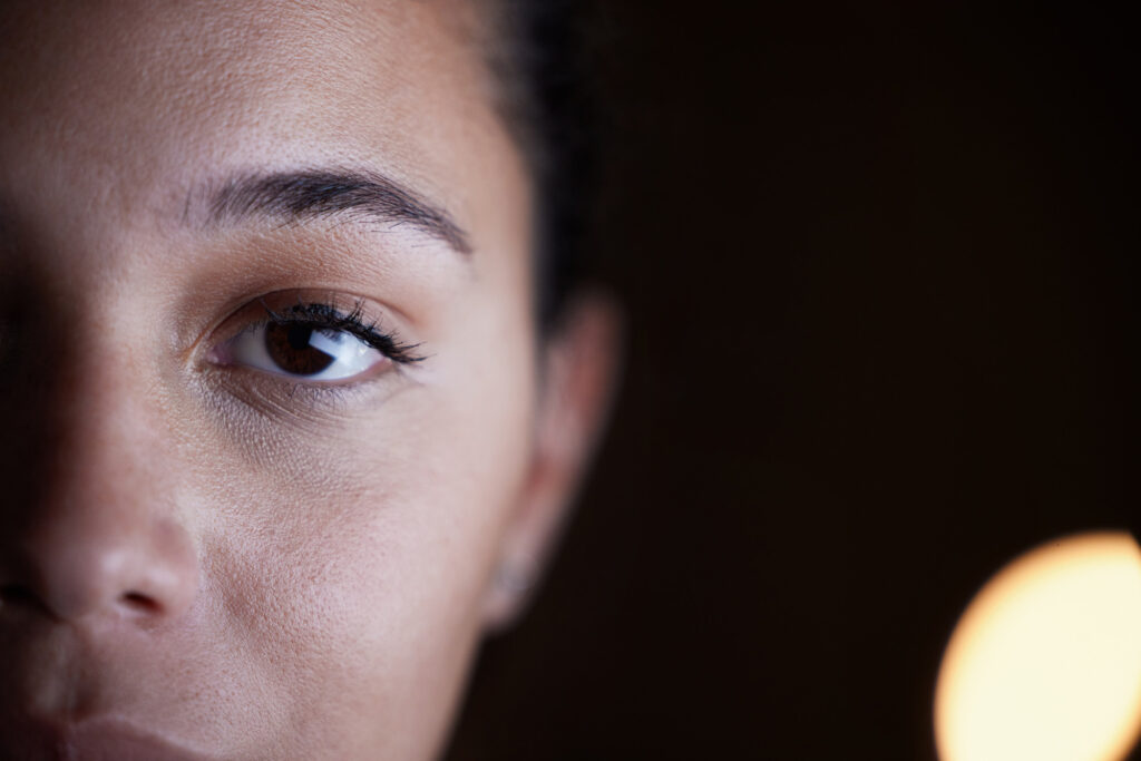 dramatic closeup shot of woman staring into camera