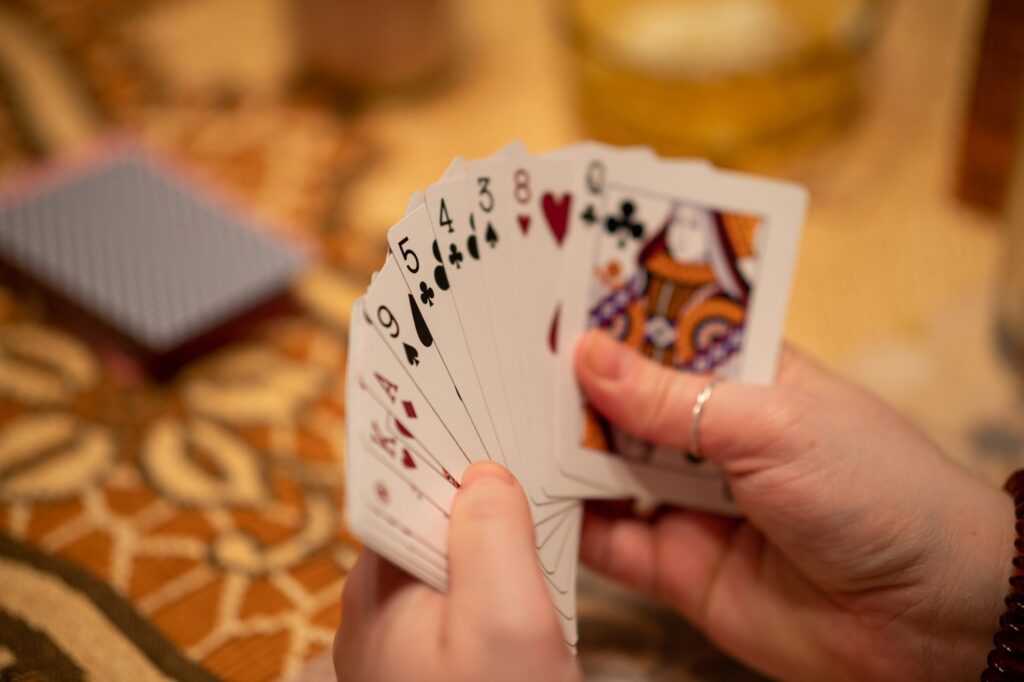 selective focus shot of a hand of cards playing euchre