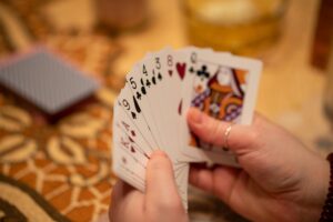 selective focus shot of a hand of cards playing euchre